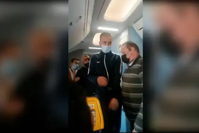 <p>The man in the video before he alarms passengers by running to the front of the plane</p>