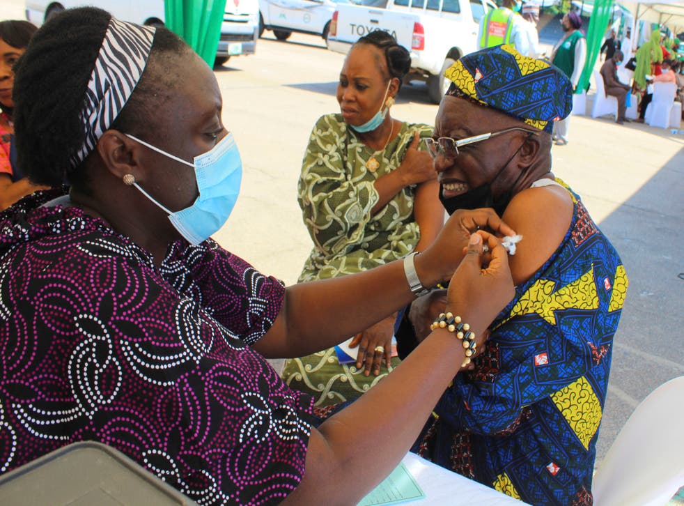 <p>Virus concerns: a Covid vaccination being administered in Abuja, capital of red list Nigeria    </p>