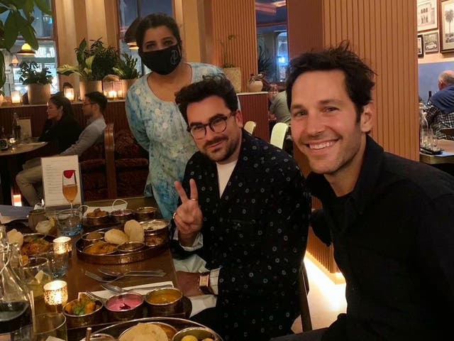 <p>The photo of Asma Khan with Dan Levy and Paul Rudd in her restaurant, Darjeeling Express, that went viral in September 2021</p>