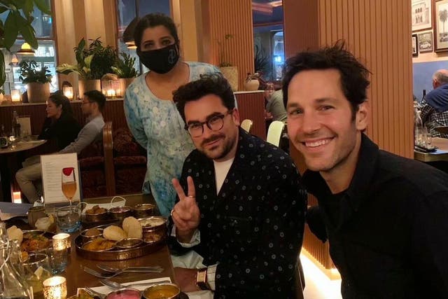 <p>The photo of Asma Khan with Dan Levy and Paul Rudd in her restaurant, Darjeeling Express, that went viral in September 2021</p>
