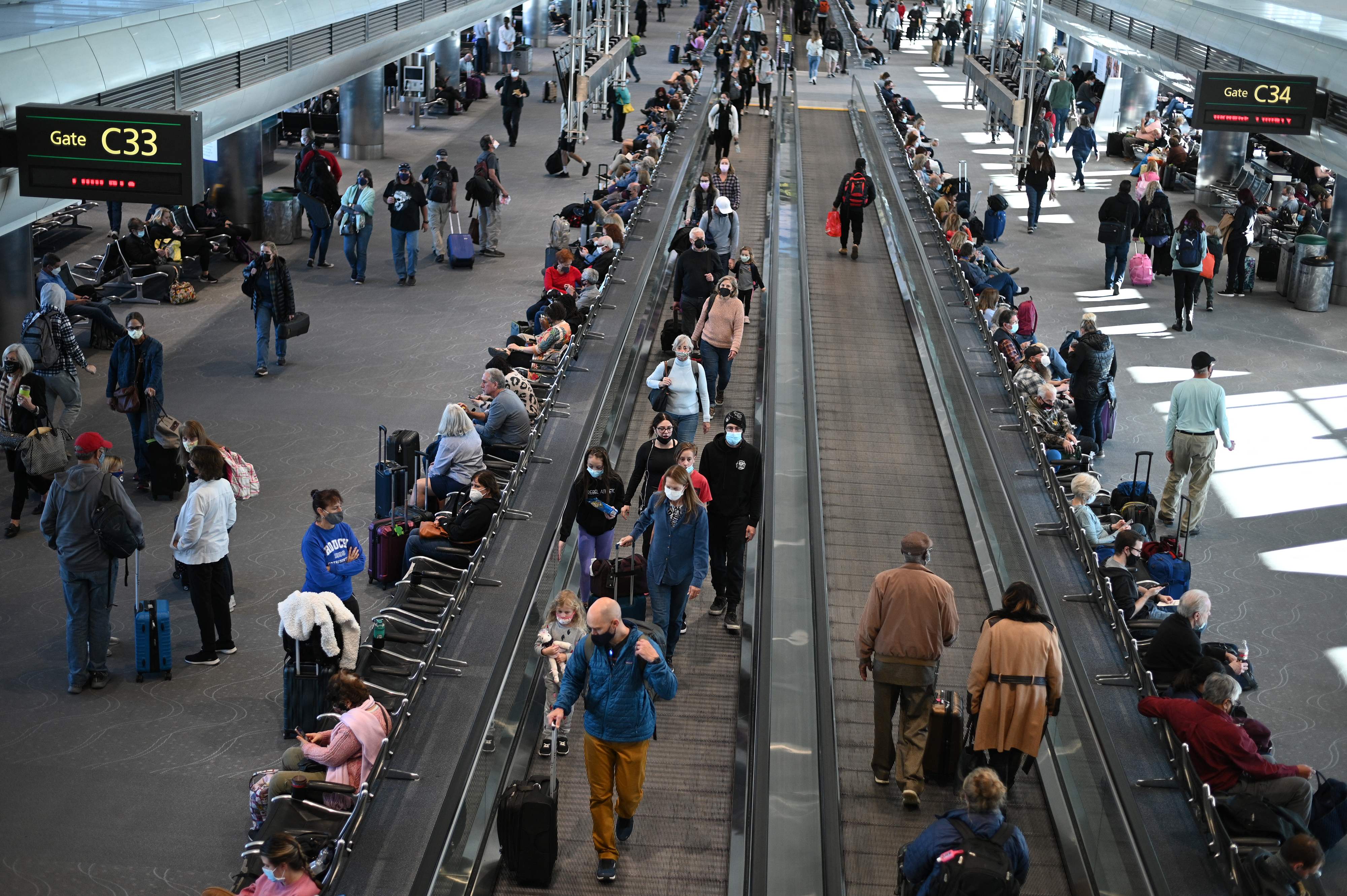 Travellers wear masks at Denver airport