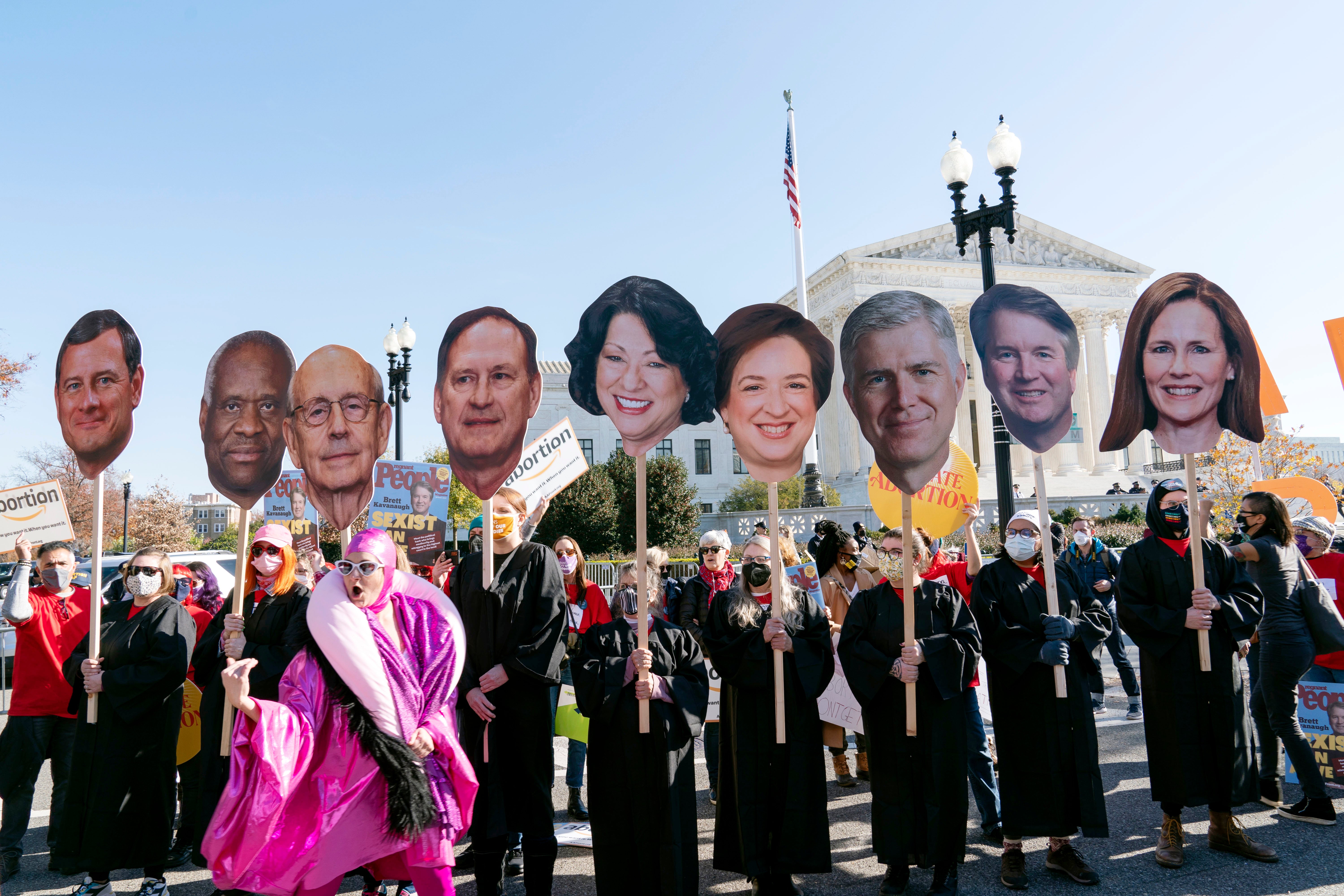 <p>Abortion rights advocates, holding cardboard cutouts of the Supreme Court Justices, demonstrate in front of the U.S. Supreme Court in Washington </p>
