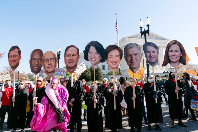 <p>Abortion rights advocates, holding cardboard cutouts of the Supreme Court Justices, demonstrate in front of the U.S. Supreme Court in Washington </p>