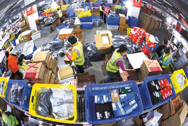 <p>Workers busy packaging goods at an e-commerce industrial zone in Lianyungang, Jiangsu province, as China’s Singles Day shopping festival starts </p>