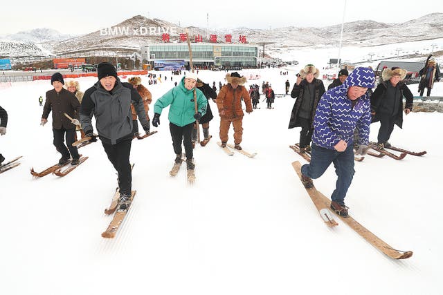 <p>Visitors using fur skis enjoy the snow at Jiangjunshan Ski Resort in Altay prefecture, Xinjiang Uygur autonomous region, in 2019</p>