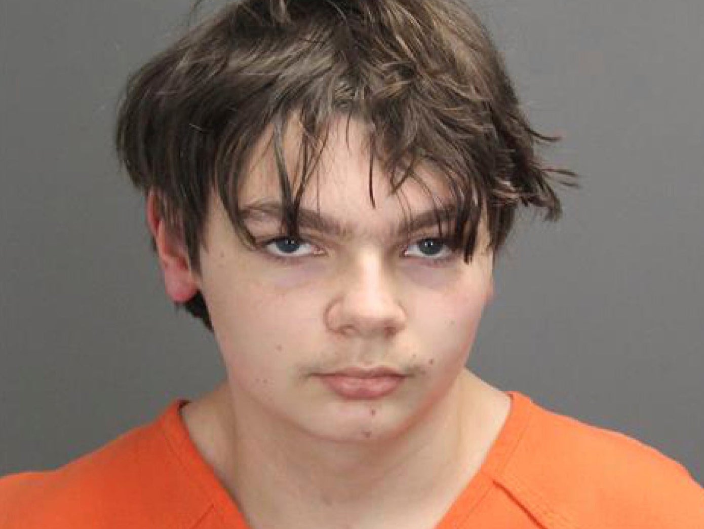 This booking photo released by the Oakland County, Mich., Sheriff’s Office shows Ethan Crumbley, 15, who is charged as an adult with murder and terrorism for a shooting that killed four fellow students and injured more at Oxford High School in Oxford, Michigan
