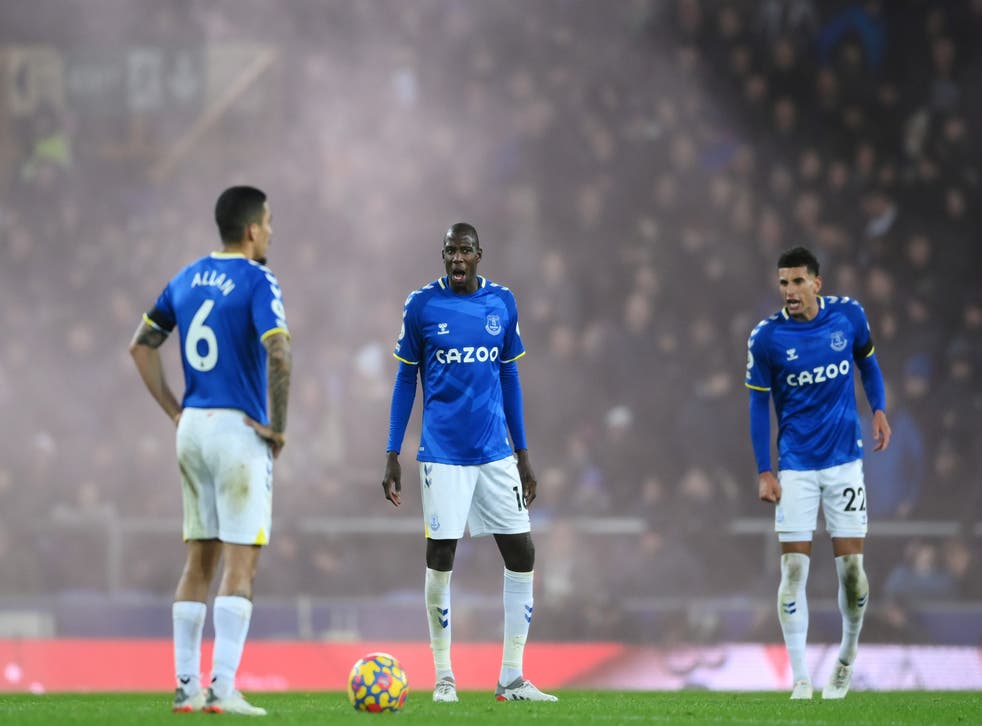 <p>Everton’s Abdoulaye Doucoure and Ben Godfrey exchange words with Allan after Liverpool’s fourth goal</p>