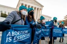 Justices signal they may toss Roe, allow new abortion limits