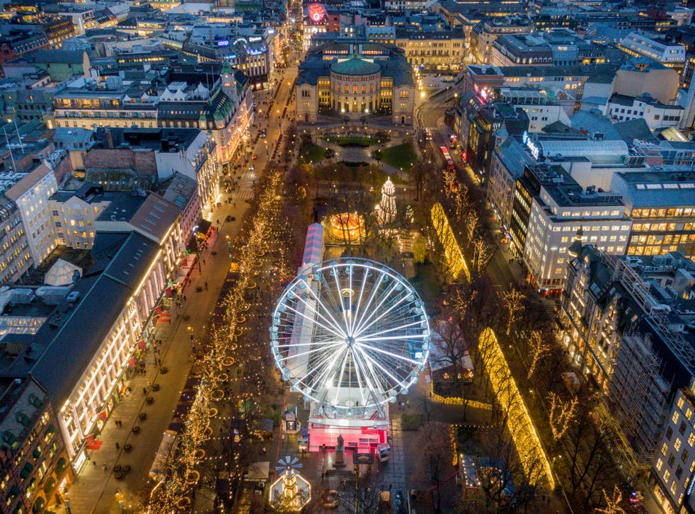 <p>The Christmas market in Oslo’s city centre, with the Norwegian parliament behind it </p>