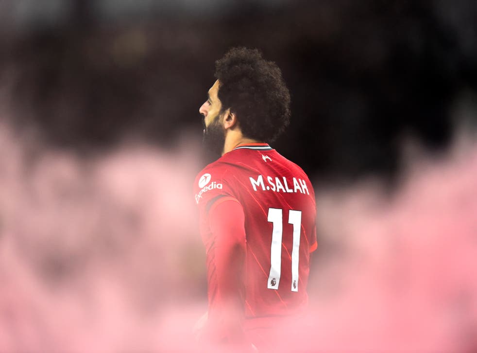 <p>Mohamed Salah of Liverpool reacts after scoring his second at Everton</p>