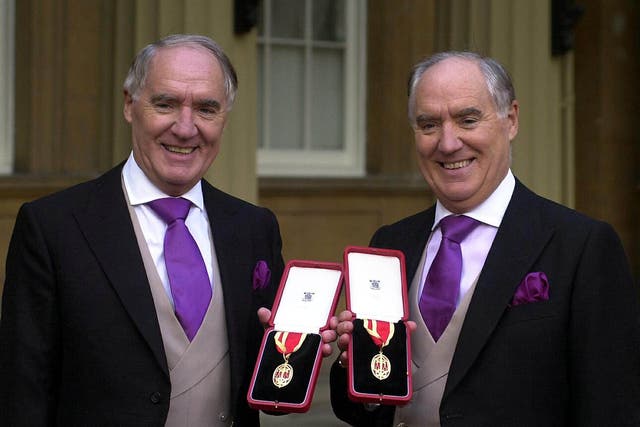 <p>Sir Frederick Barclay, right, and twin brother Sir David after receiving their knighthoods in 2000</p>