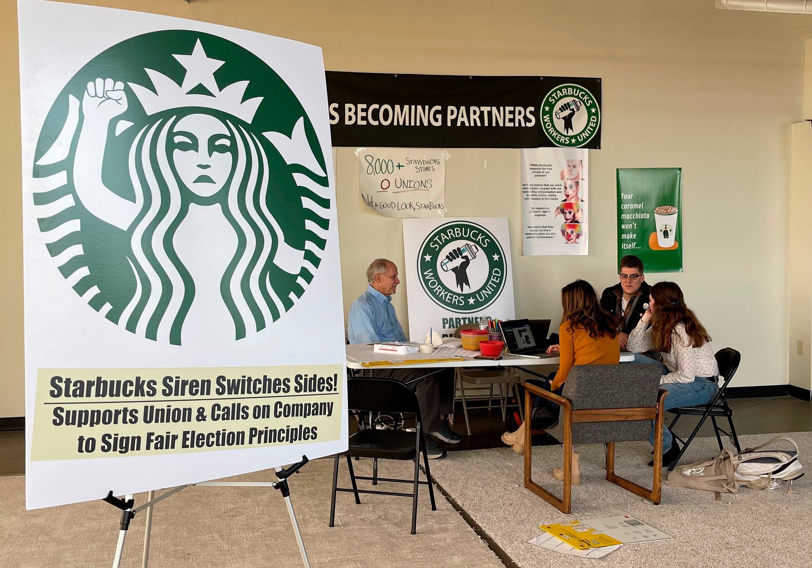 Richard Bensinger, left, who is advising unionization efforts, along with baristas Casey Moore, right, Brian Murray, second from left, and Jaz Brisack, second from right, discuss their efforts to unionize three Buffalo-area stores, inside the movements headquarters on Thursday, Oct. 28, 2021 in Buffalo, NY.
