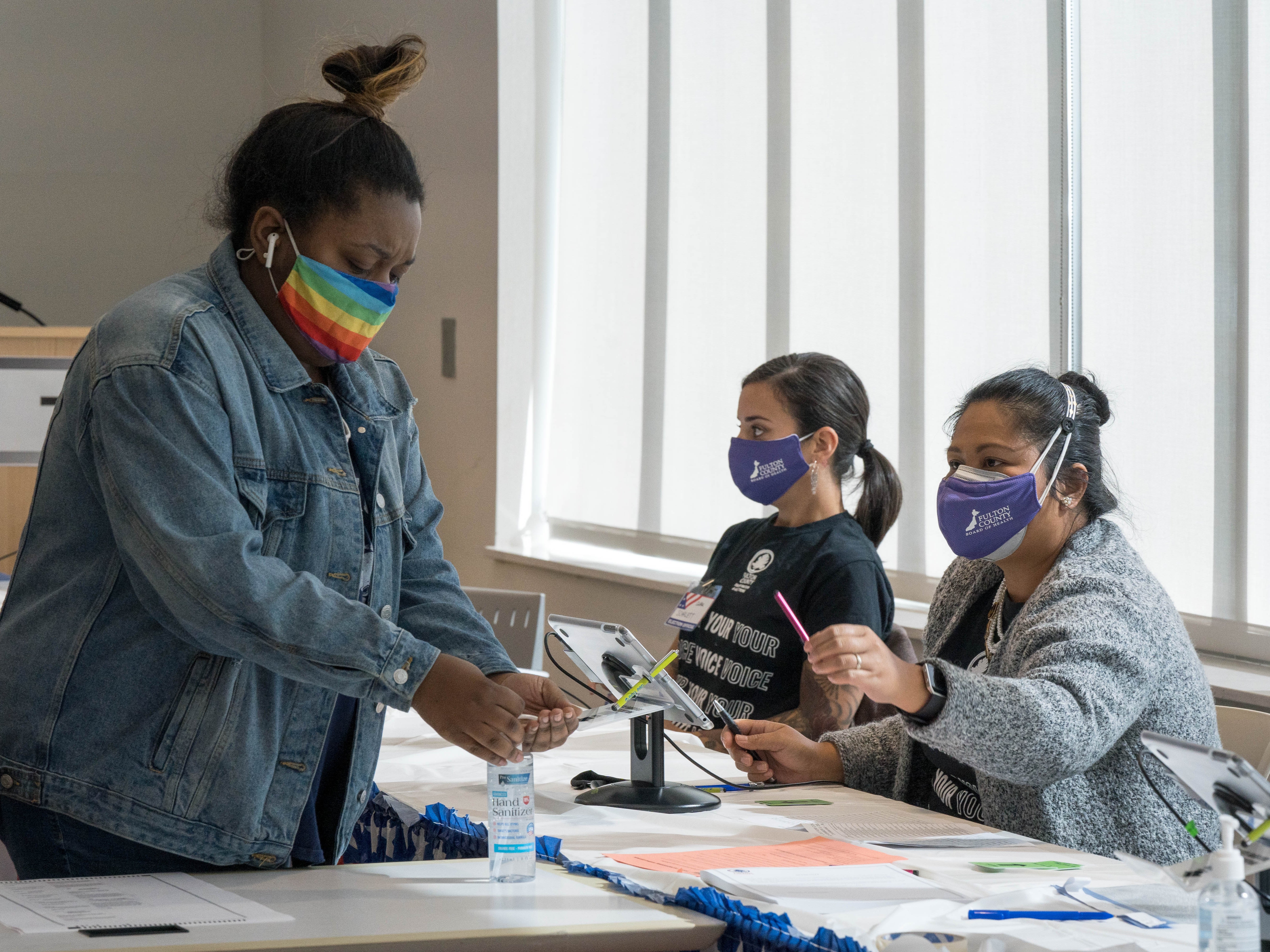 Georgia election workers targeted by Trump supporters over his ‘big lie’ sue conspiracy website