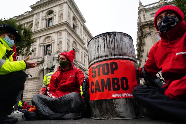 <p>Campaigners from Greenpeace opposed to Cambo oilfield project outside Downing Street</p>