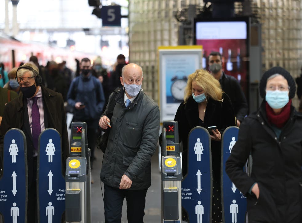 Passengers wearing masks travelling via Waterloo station in London (James Manning/PA)