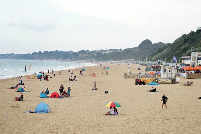 <p>People on Bournemouth beach in Dorset</p>
