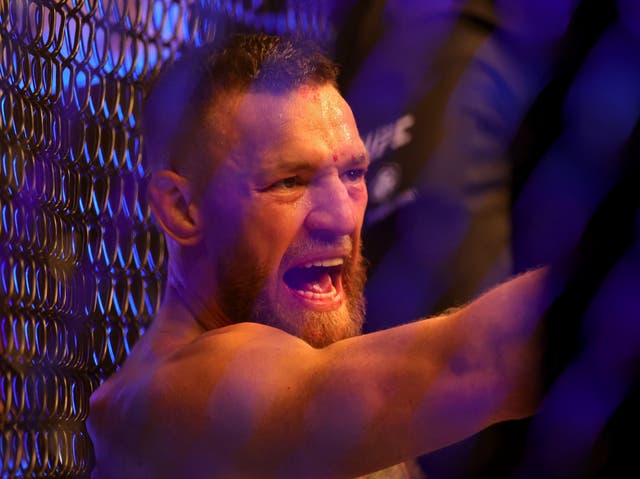 <p>Conor McGregor after breaking his leg against Dustin Poirier in July</p>