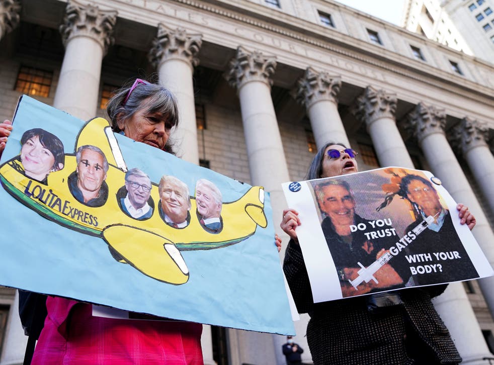 <p>Protesters stand outside the court on the first day of the Ghislaine Maxwell trial in New York City, 29 November 2021</p>
