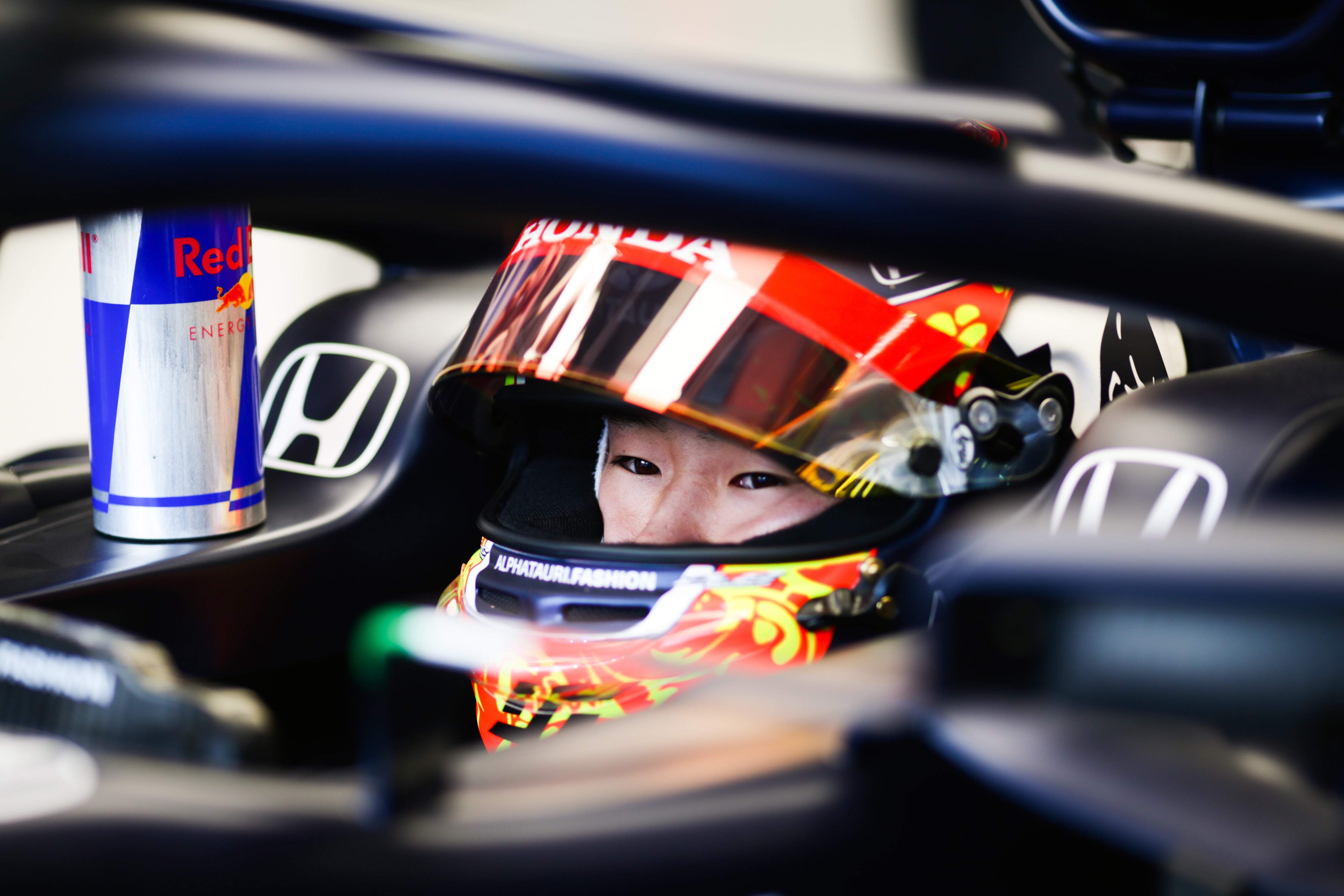 Yuki Tsunoda of Japan and Scuderia AlphaTauri prepares to drive in the garage during practice