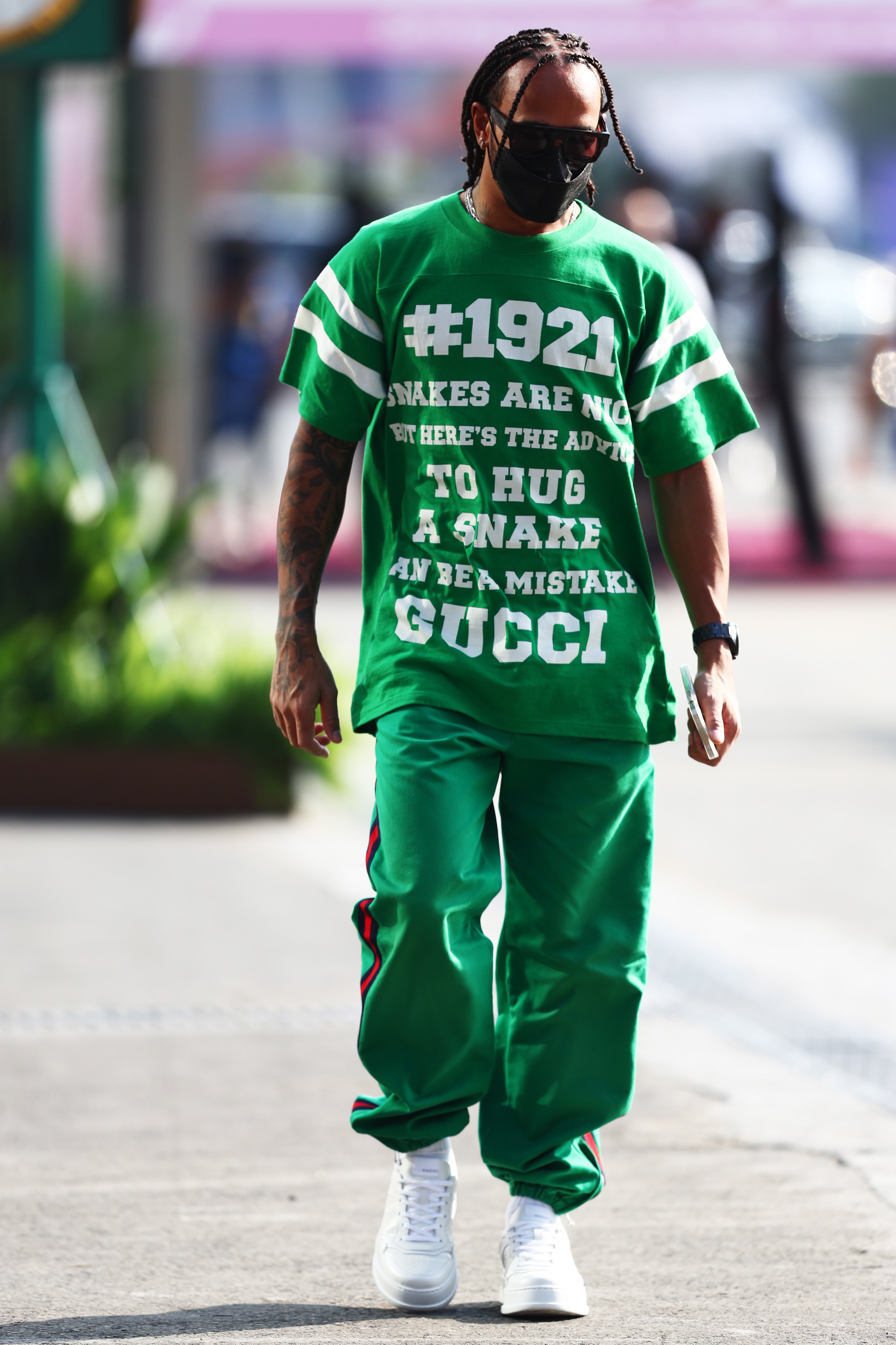 Lewis Hamilton walks in the Paddock