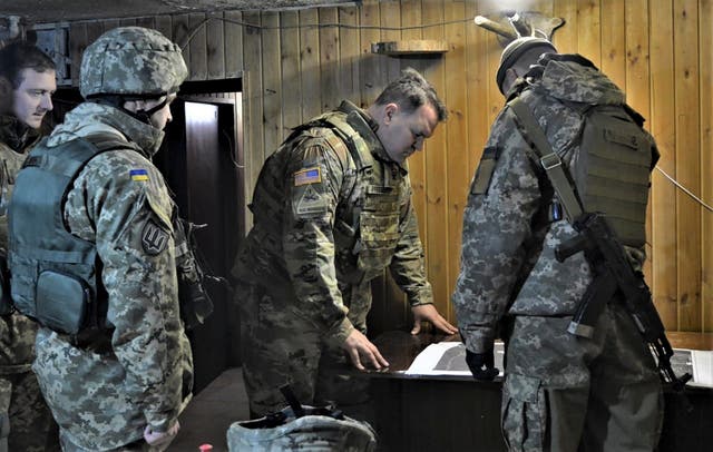 <p>Attache of the Land Forces at the US Embassy in Ukraine Colonel Brandon Presley looks at the map during the visit by a delegation of the US Embassy in Ukraine to the Joint Forces operation area in the war-hit Donetsk region</p>