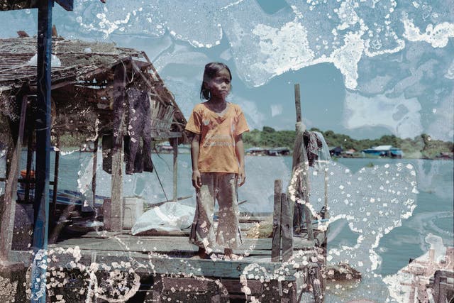 <p>Mara, 9, standing on a fishing farm platform on Tonlé Sap lake in Cambodia</p>
