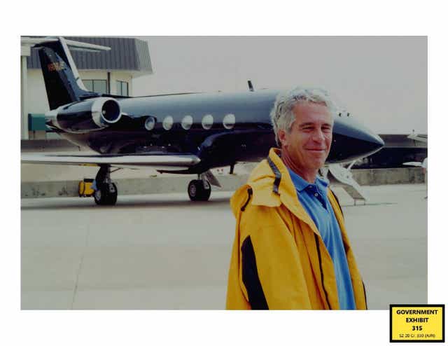 <p>Jeffrey Epstein standing in front of his second private plans (US Department of Justice/PA)</p>