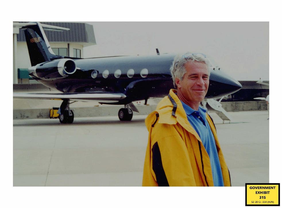 Jeffrey Epstein standing in front of his second private plans (US Department of Justice/PA)