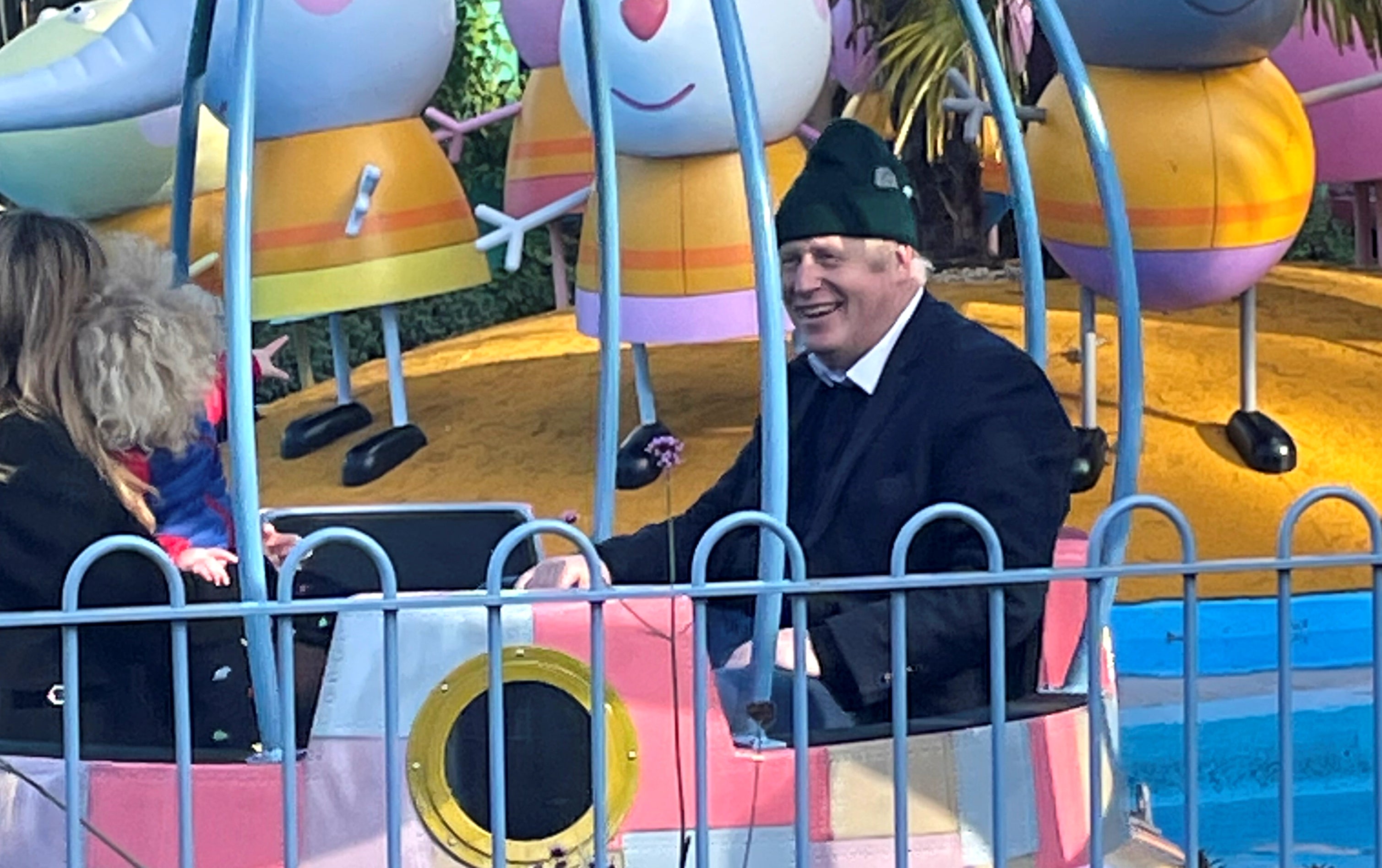 Boris and Carrie Johnson and their son Wilfred enjoy a ride at Peppa Pig World near Ower, Hampshire, last month