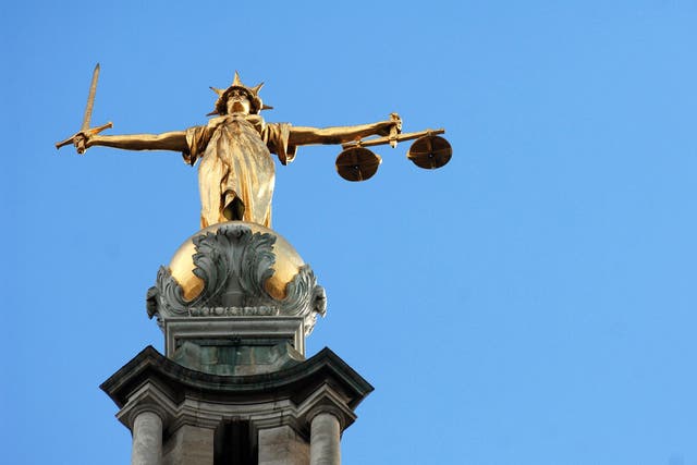 The statue of justice on the Old Bailey (Clara Molden/PA)