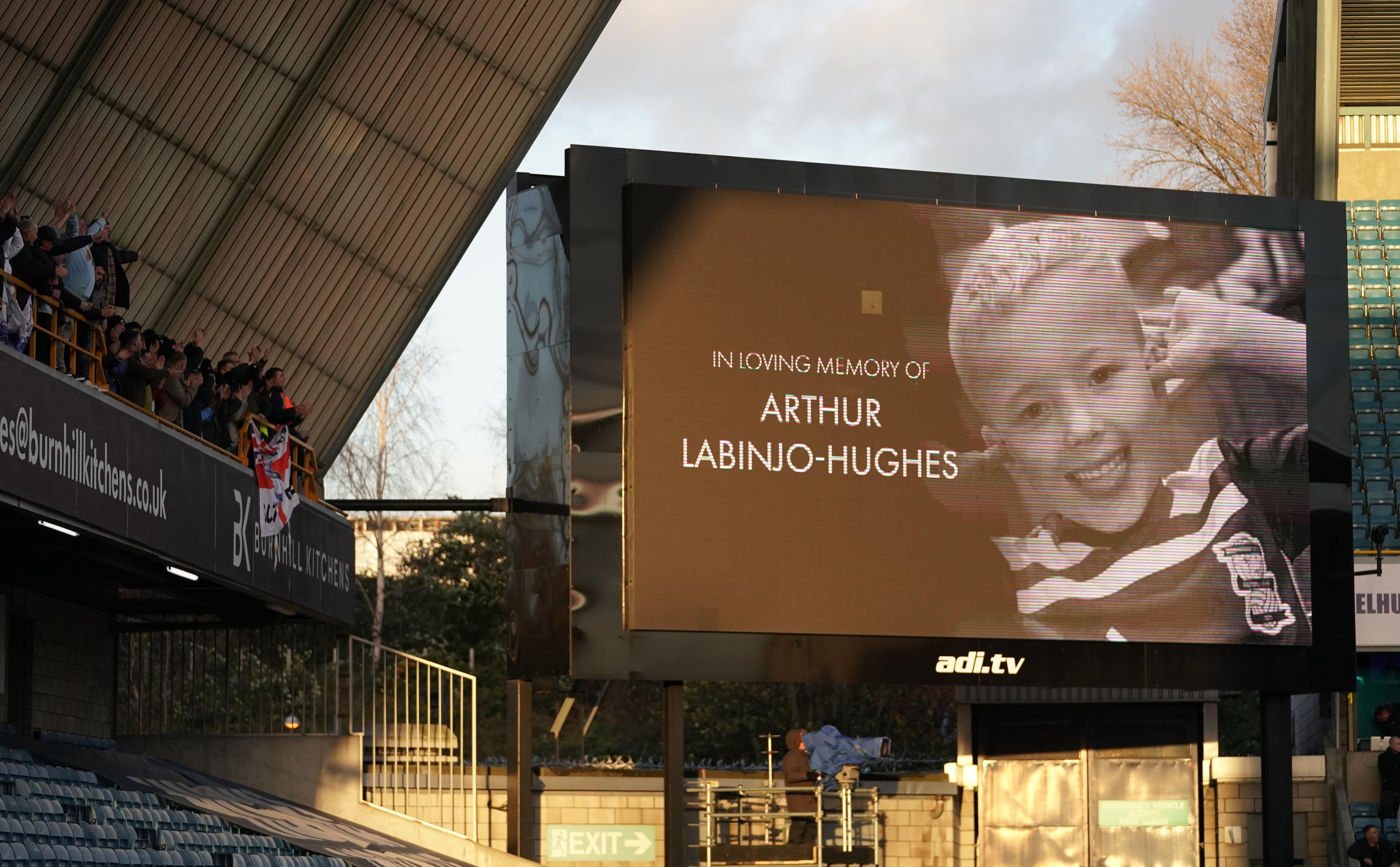 A memorial for Arthur Labinjo-Hughes is shown on the big screen before the Sky Bet Championship match at The Den, London (PA)