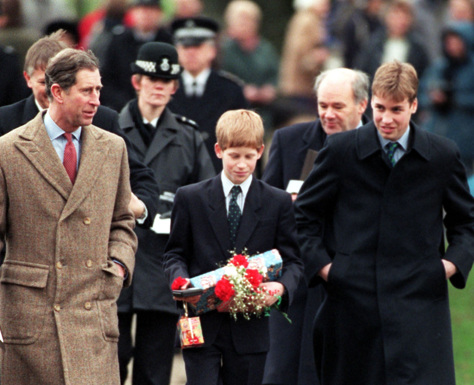 William and Harry pictured with their father leaving church after the Christmas Day service (John Stillwell/PA)