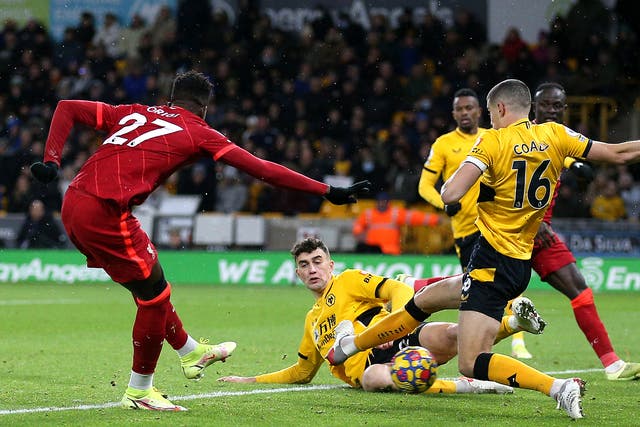 Divock Origi scores Liverpool’s injury-time winner at Wolves (Nigel French/PA)