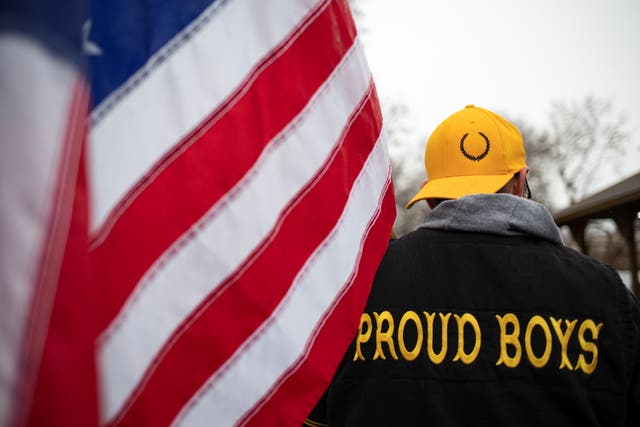 <p>A member of the Proud Boys at a rally in Michigan in November. The group has been designated a hate group by the Southern Poverty Law Center </p>