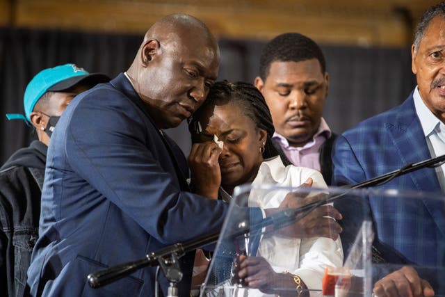 <p>Jelani Day’s mother Carmen Day is comforted by civil rights attorney Ben Crump at the news conference at the Rainbow PUSH Coalition headquarters in Chicago on Friday</p>