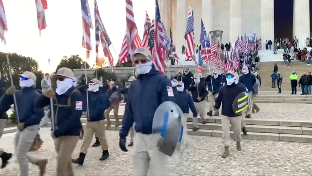 <p>Hundreds of members of the white supremacist group ‘Patriot Front’ march past the Lincoln Memorial</p>