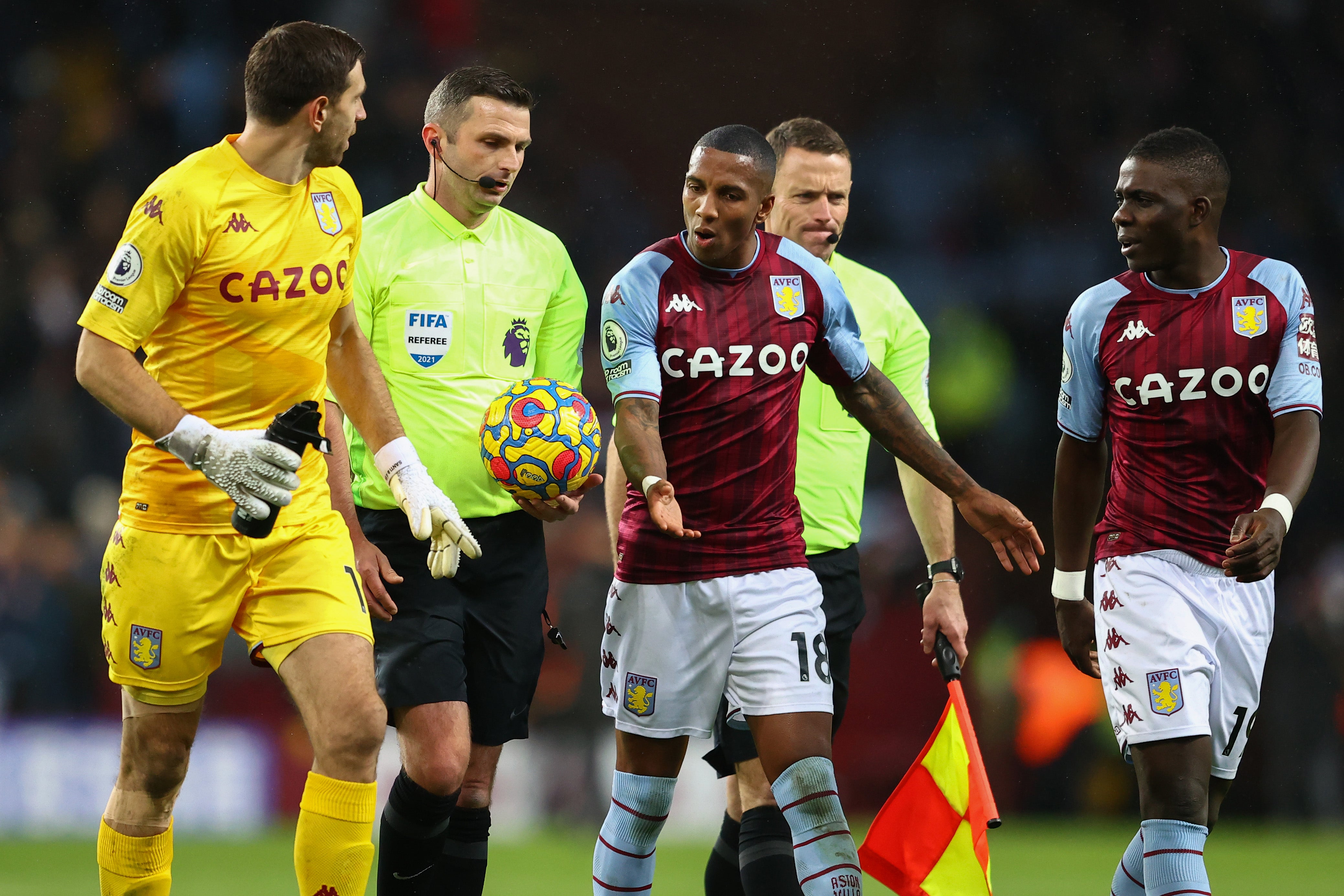Aston Villa players remonstrate with referee Michael Oliver
