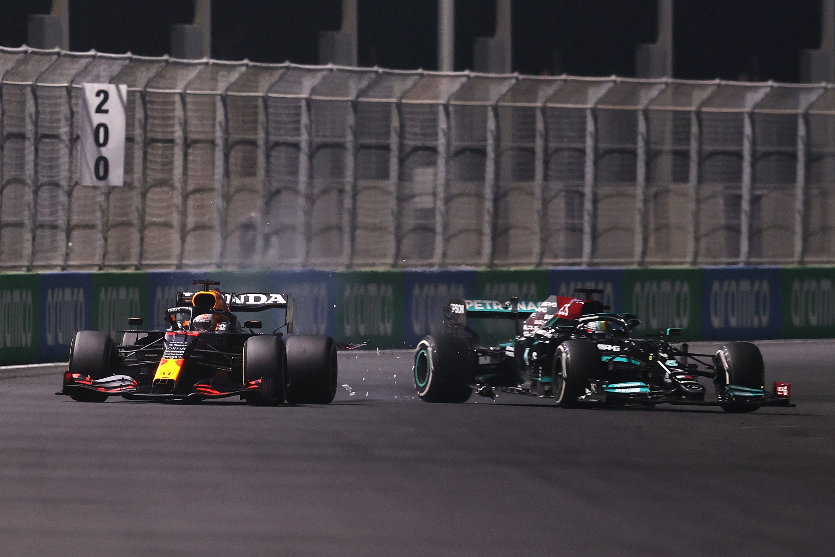 Max Verstappen and Lewis Hamilton come in contact