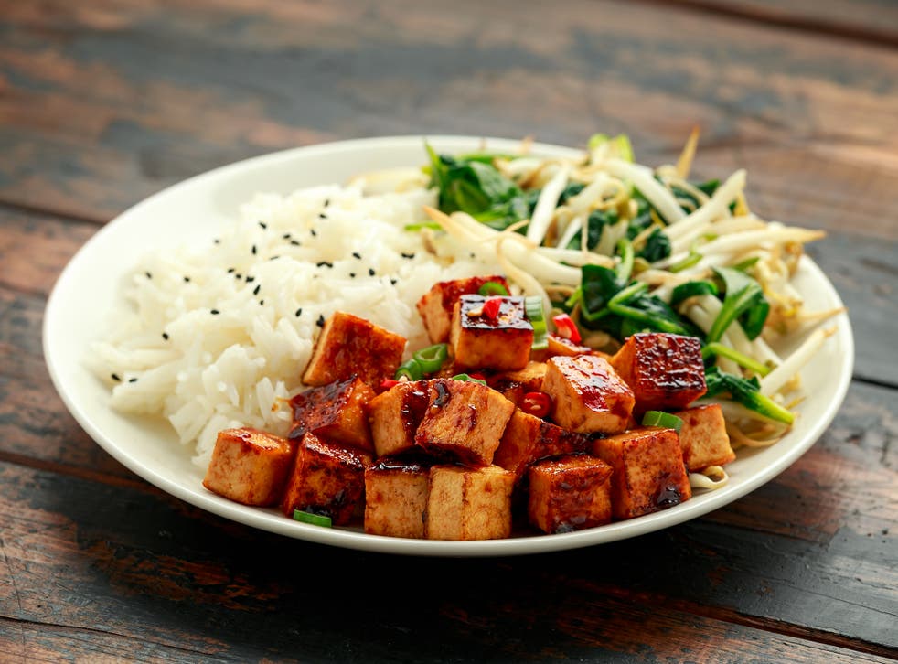 <p>Crispy tofu with cashews and blistered snap peas</p>