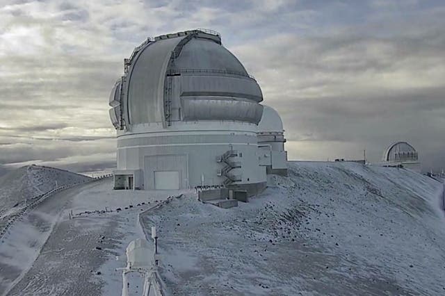 <p>The Mauna Kea summit in Hawaii last week, covered in snow. Blizzard warnings have been issued for the island state</p>
