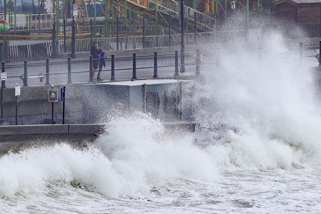Waves crashing into the seafront at Tramore in County Waterford (Niall Carson/PA)