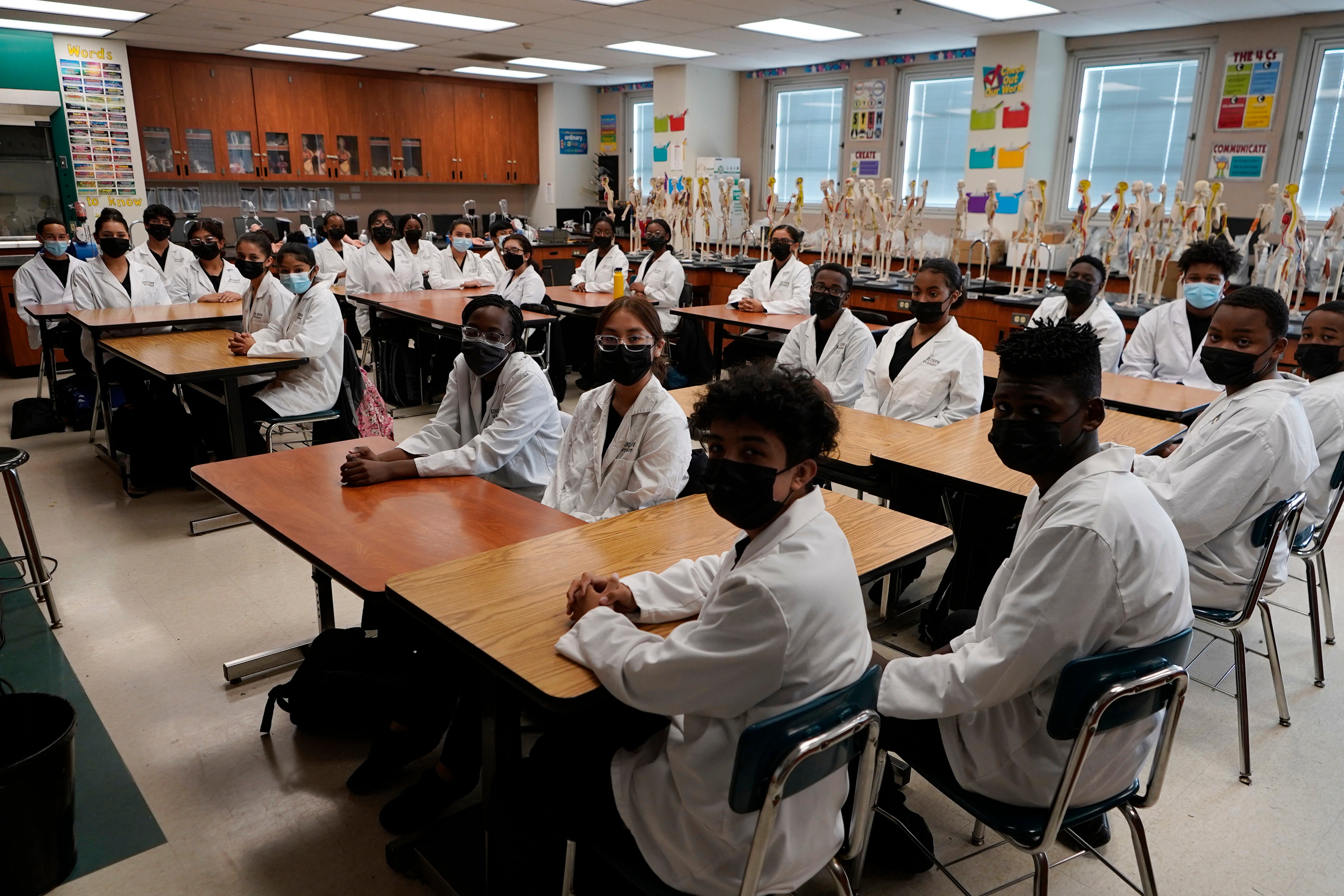 File High school medical students wear face masks in class during a tour in the Willowbrook area of Los Angeles
