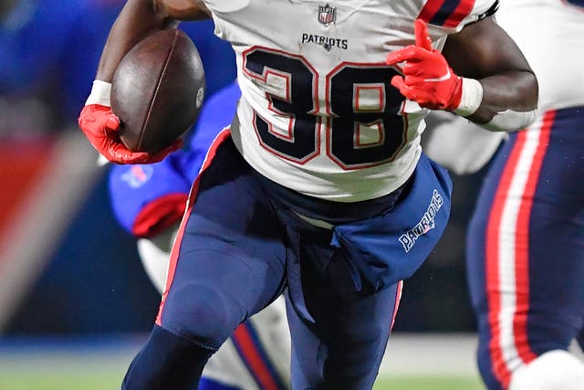 New England Patriots running back Rhamondre Stevenson (38) carries the football during the second half of an NFL football game against the Buffalo Bills in Orchard Park, New York (AP Photo/Adrian Kraus)