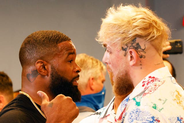 <p>Tyron Woodley (left) faces off with Jake Paul ahead of their first clash</p>