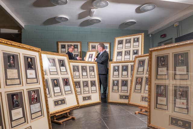 Chris Albury and Hamilton Bland with the framed collection of every signature of Great Britain’s Prime Ministers. Credit: Jamie Gray Photography