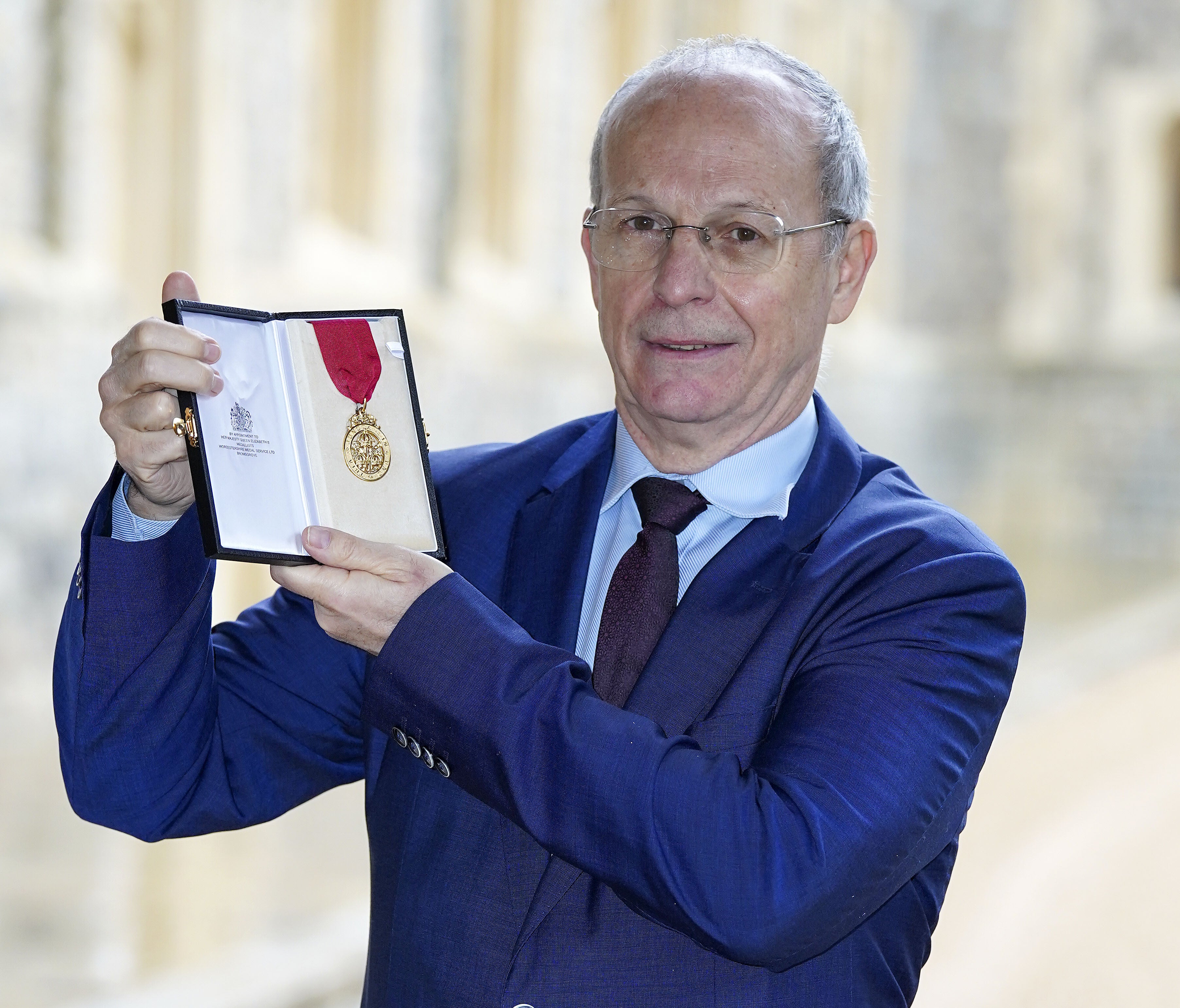 Peter Betts from London with his award after he was made a Companion Order Of The Bath by the Duke of Cambridge (Steve Parsons/PA)