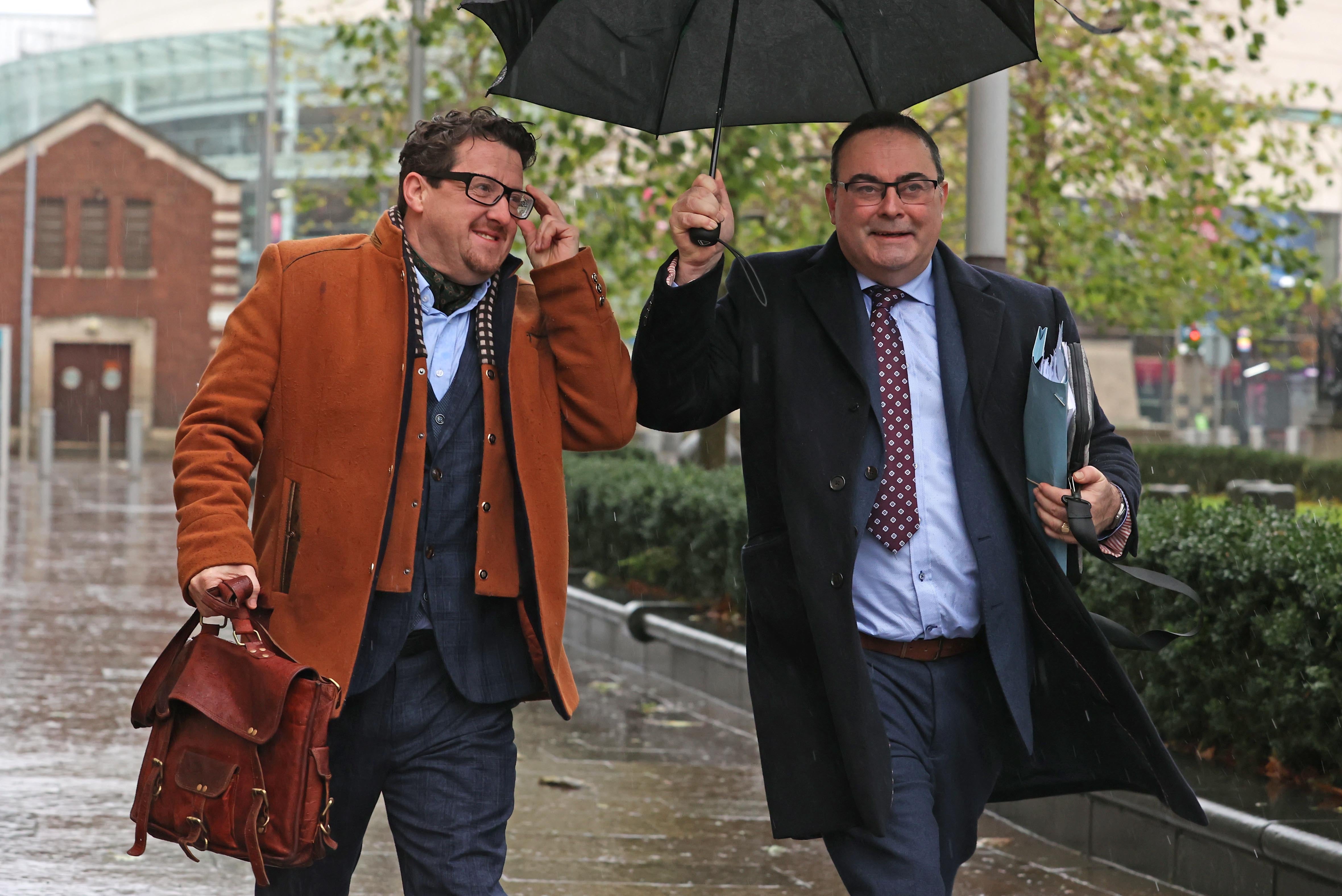 Sean Napier (left) and his solicitor Paul Farrell arrive at the Royal Courts of Justice in Belfast (Liam McBurney/PA)