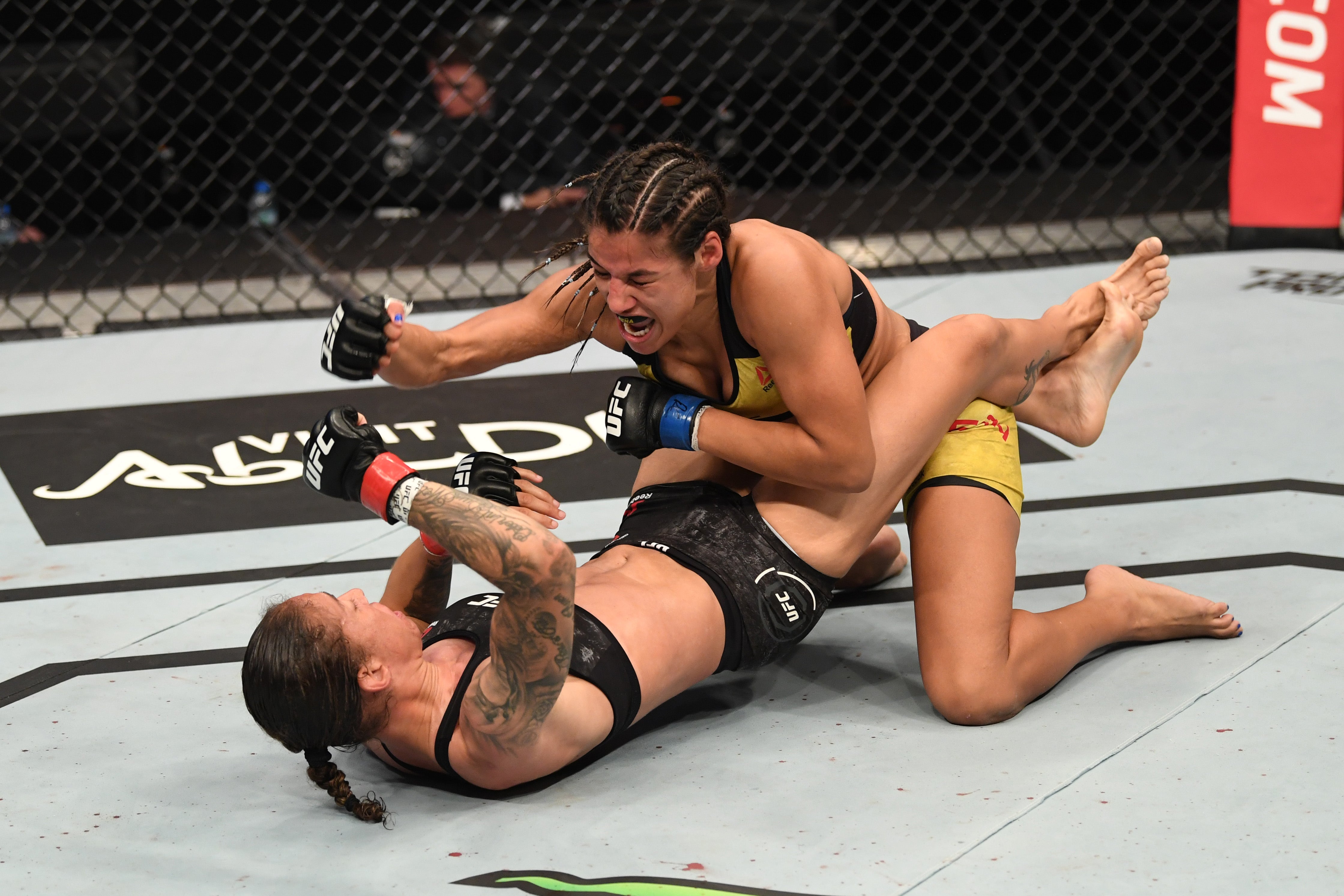 Julianna Pena (top) during her fight against Germaine de Randamie