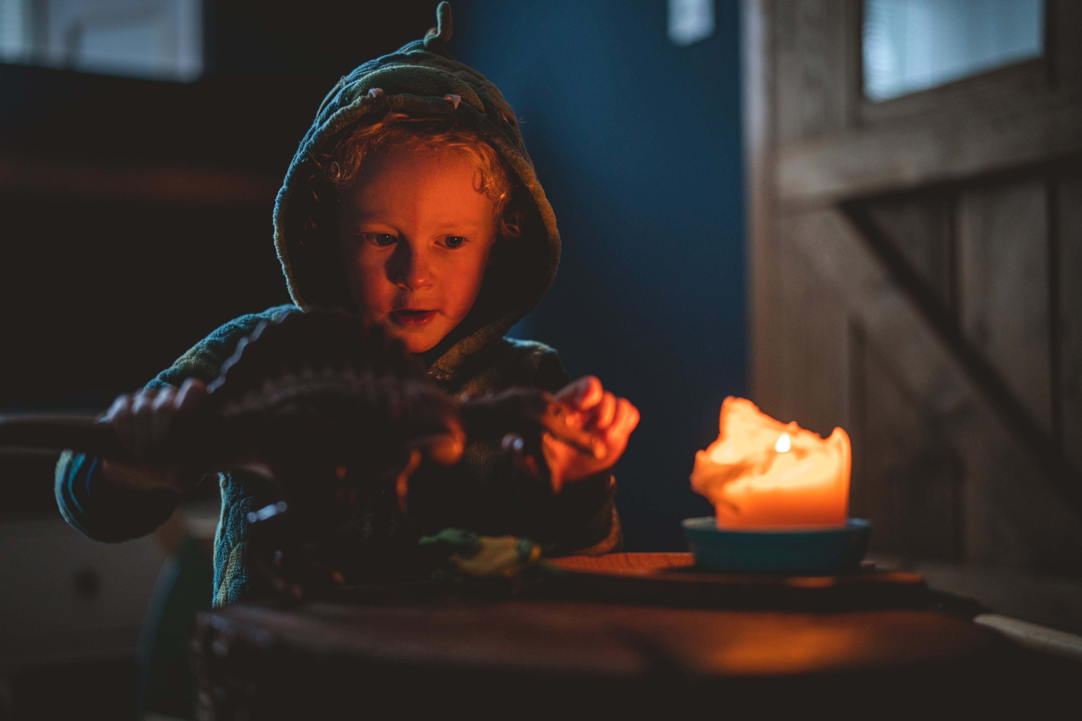 John Shahabeddin, a wedding photographer in Northumberland, captured his family’s time in lockdown, including shots of his son Arthur (pictured) in candlelight (John Shahabeddin)