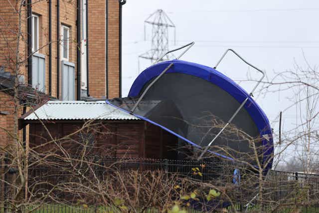 An overturned trampoline at a house in Clon Elagh in Londonderry, as Storm Barra hits the UK and Ireland (Liam McBurney/PA)